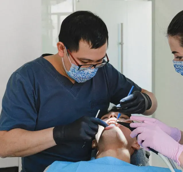 Dr Clark Eom treating a patient