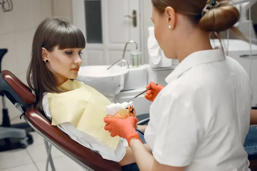 Patient having a tooth assessed